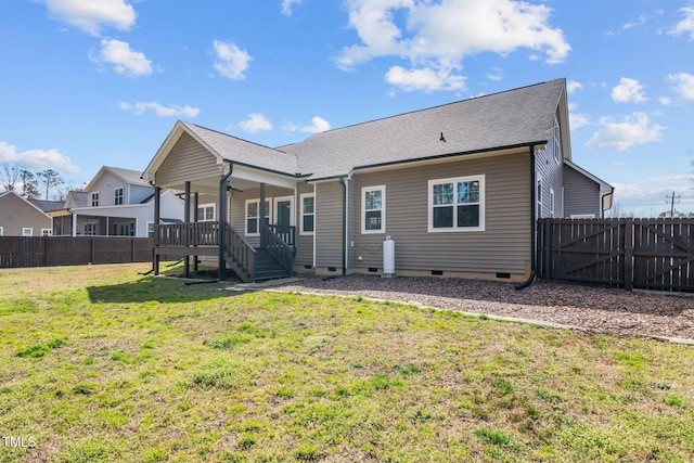 back of house featuring ceiling fan, a fenced backyard, a yard, crawl space, and roof with shingles