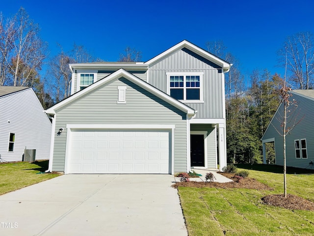 traditional-style home with driveway, a garage, a front lawn, and board and batten siding