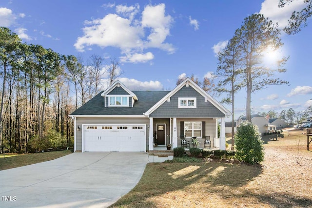 view of front of property featuring driveway and a porch