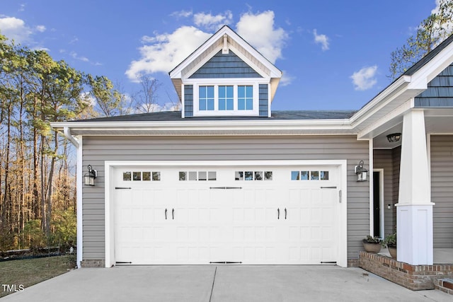 garage with concrete driveway