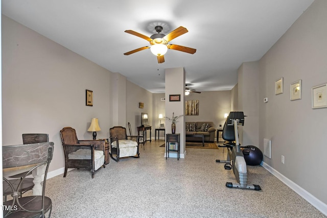 exercise area with visible vents, a ceiling fan, and baseboards