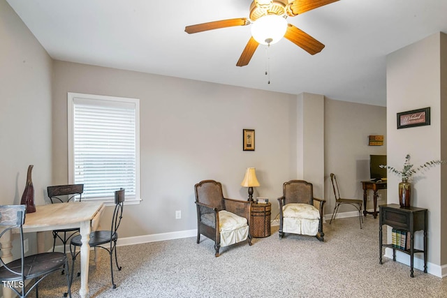 office space featuring baseboards and a ceiling fan