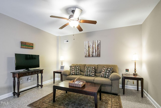 living room with ceiling fan, speckled floor, visible vents, and baseboards