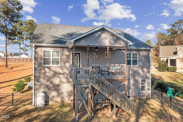 back of property featuring ceiling fan, crawl space, stairs, fence, and a wooden deck