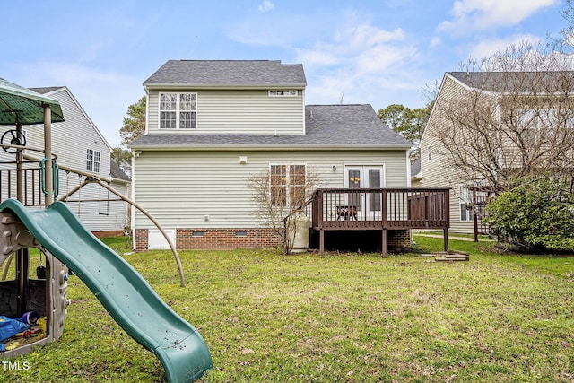 rear view of property featuring crawl space, a lawn, a playground, and a deck