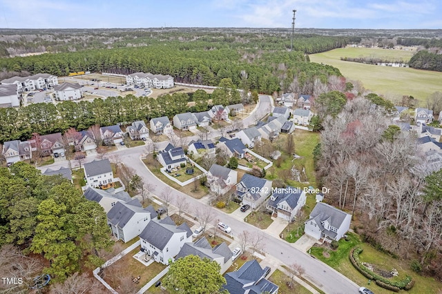 aerial view with a residential view and a wooded view