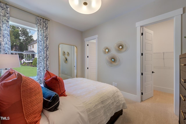 carpeted bedroom with baseboards