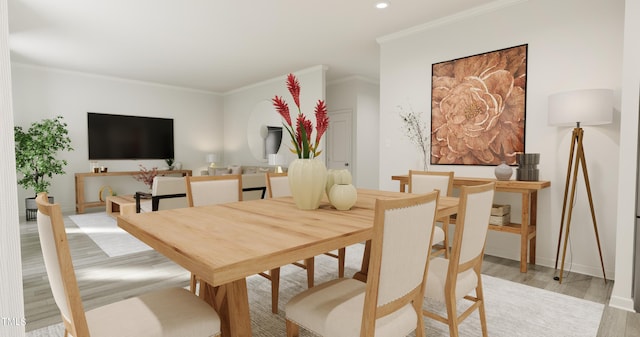 dining space with ornamental molding, recessed lighting, light wood-style flooring, and baseboards