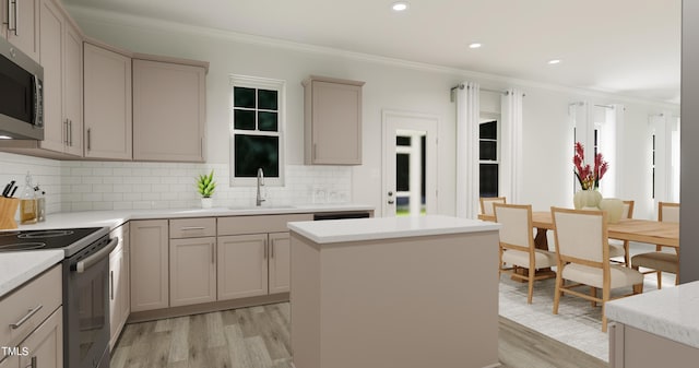 kitchen with electric stove, crown molding, light wood finished floors, stainless steel microwave, and a sink