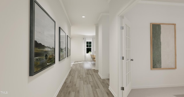 hall featuring baseboards, light wood-style floors, recessed lighting, and crown molding