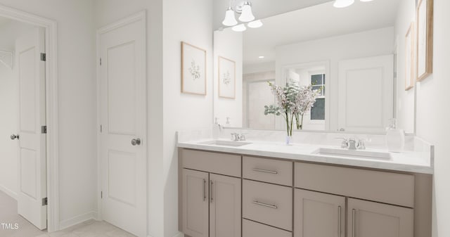 full bathroom featuring tiled shower, a sink, and double vanity