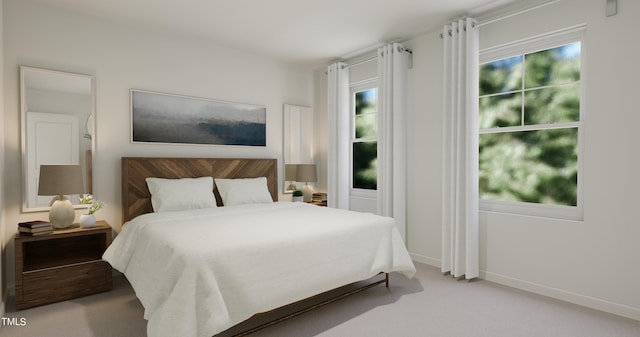 carpeted bedroom featuring multiple windows and baseboards