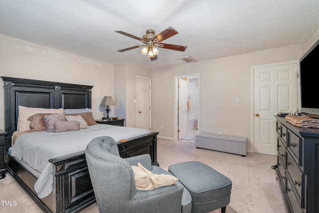 bedroom featuring baseboards, visible vents, a textured ceiling, and light colored carpet