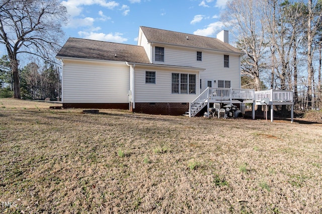 back of property featuring a deck, stairs, a yard, crawl space, and a chimney