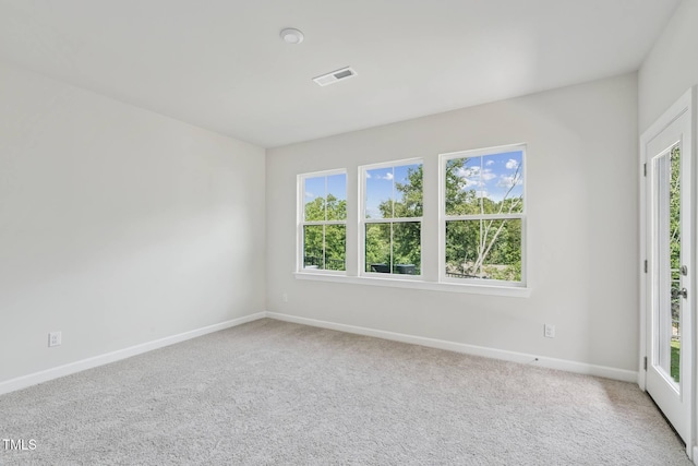 4706 Cypress Tree Ln, Raleigh, NC 27612 - unfurnished room with plenty of natural light, baseboards, and carpet