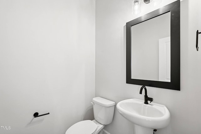 4706 Cypress Tree Ln, Raleigh, NC 27612 - half bathroom featuring toilet and a sink