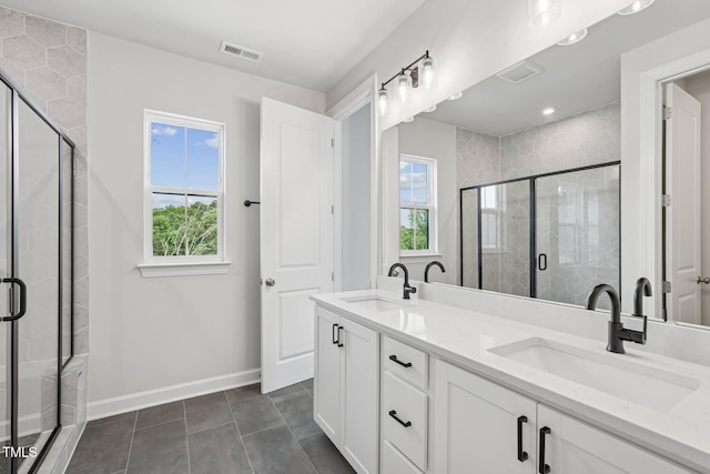 4706 Cypress Tree Ln, Raleigh, NC 27612 - full bathroom featuring plenty of natural light, double vanity, baseboards, and tile patterned floors