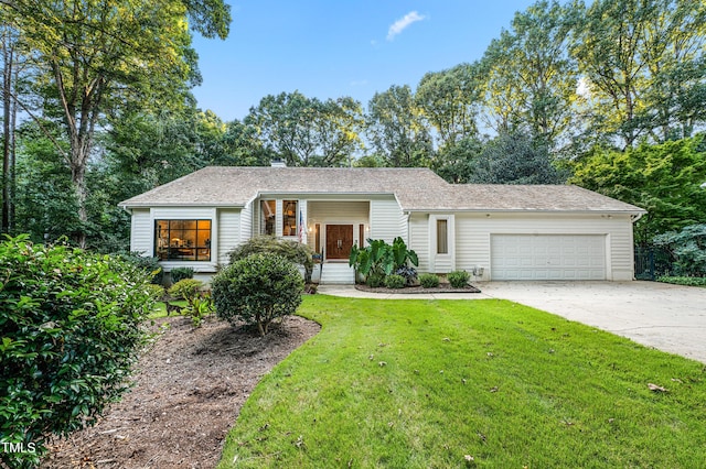 single story home with a garage, concrete driveway, a shingled roof, and a front lawn