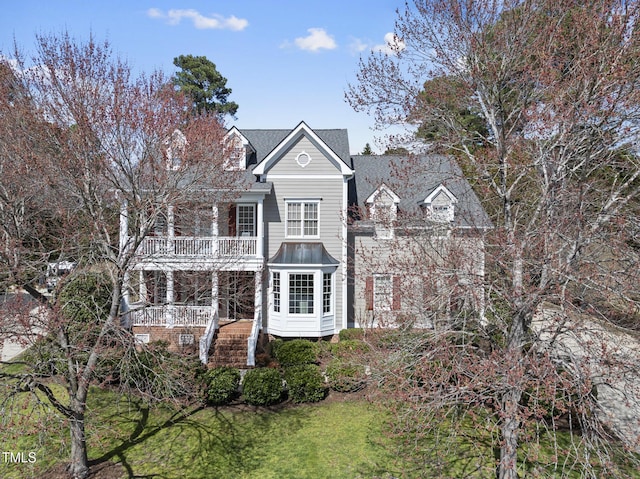 view of front of house with a balcony