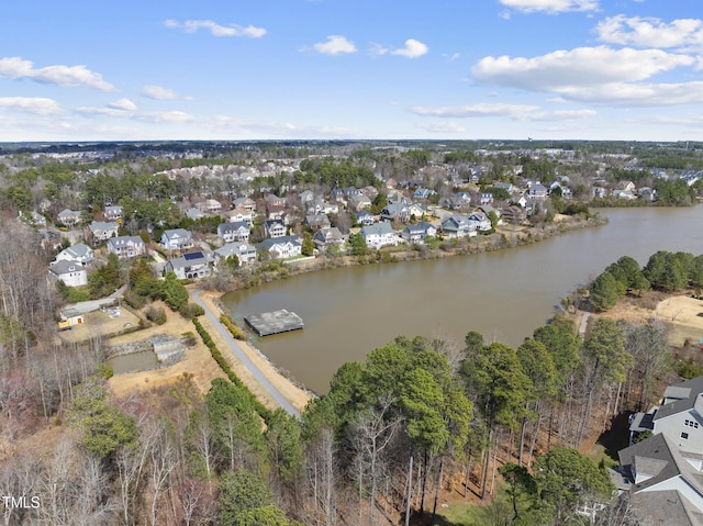 drone / aerial view with a residential view and a water view