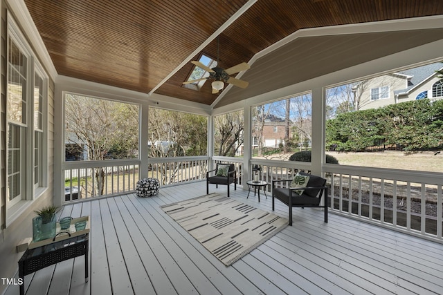 exterior space with vaulted ceiling, wood ceiling, and ceiling fan