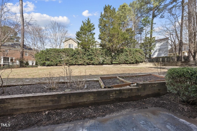 view of yard with a garden and fence