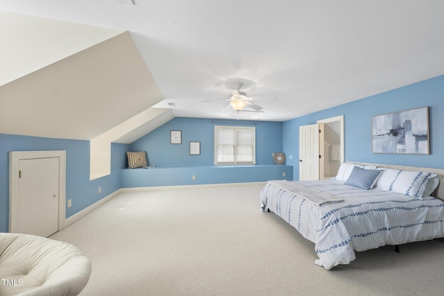 bedroom with lofted ceiling, a ceiling fan, baseboards, and carpet floors