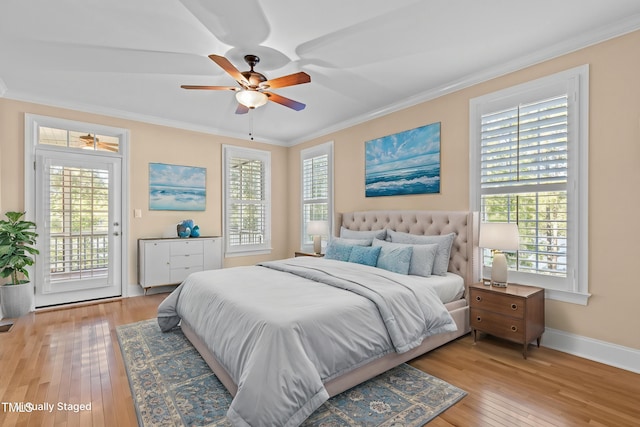 bedroom featuring access to exterior, light wood finished floors, crown molding, baseboards, and a ceiling fan