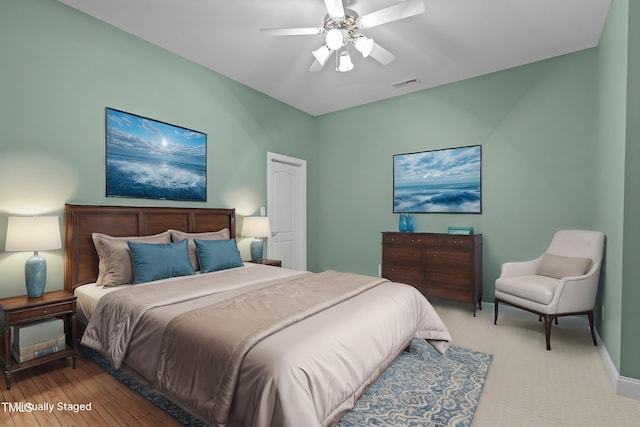 bedroom featuring baseboards, visible vents, and ceiling fan