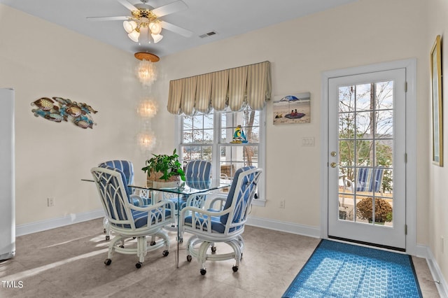 dining space featuring tile patterned flooring, visible vents, a ceiling fan, and baseboards