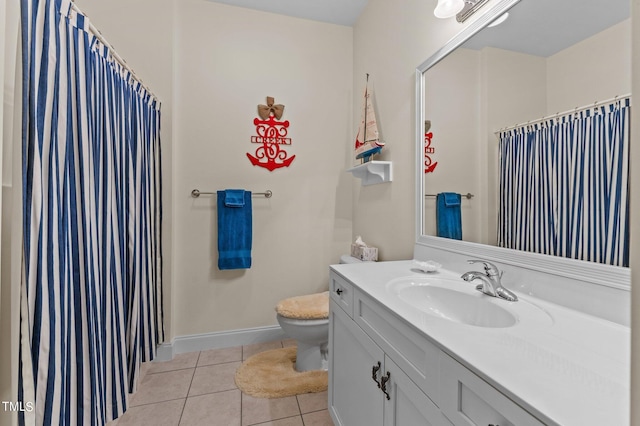 bathroom with vanity, baseboards, tile patterned flooring, curtained shower, and toilet