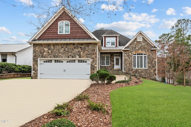 craftsman house featuring a standing seam roof, a front yard, and driveway