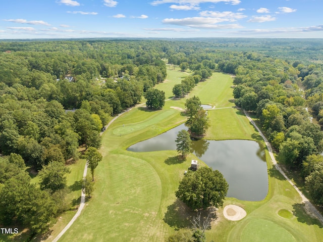 birds eye view of property featuring view of golf course, a forest view, and a water view