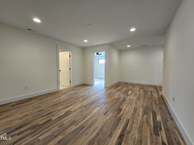 empty room with recessed lighting, visible vents, and wood finished floors