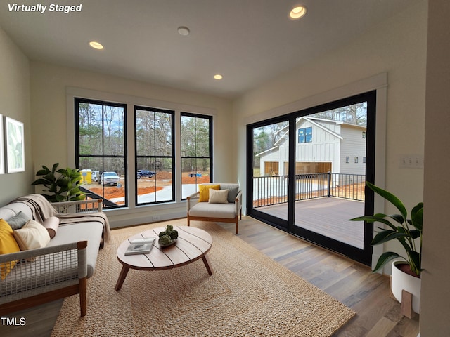 interior space featuring wood finished floors and recessed lighting