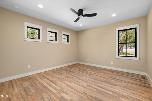 empty room featuring baseboards, light wood-style floors, ceiling fan, and recessed lighting