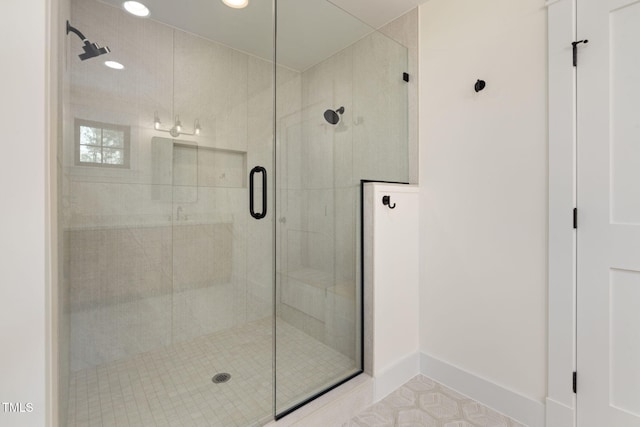 full bath featuring a stall shower, baseboards, and recessed lighting
