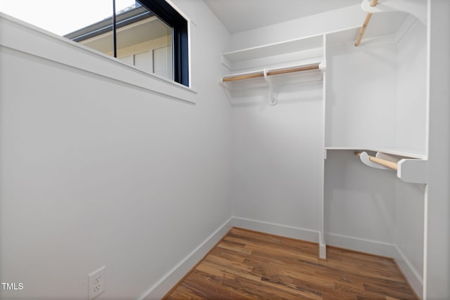 spacious closet with wood finished floors