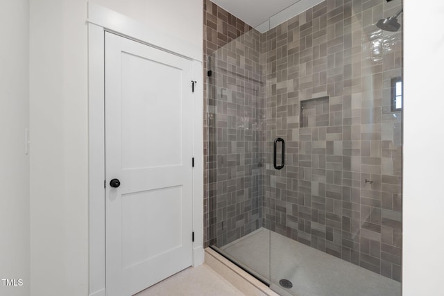 bathroom featuring a shower stall
