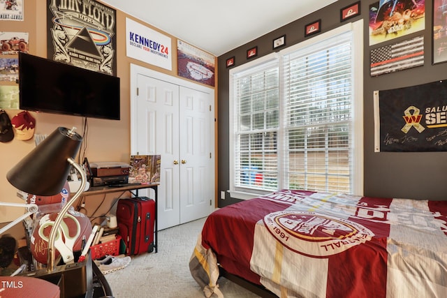 bedroom with carpet flooring and a closet