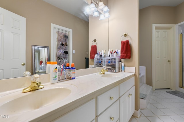 full bathroom with tile patterned flooring, double vanity, a notable chandelier, and a sink