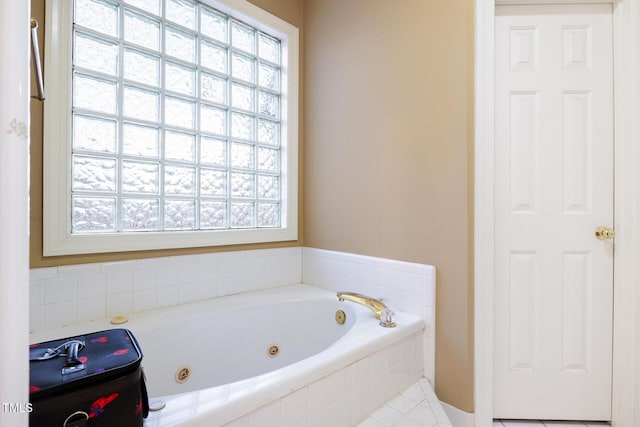 full bathroom featuring a whirlpool tub