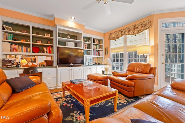 living area with ornamental molding and a ceiling fan