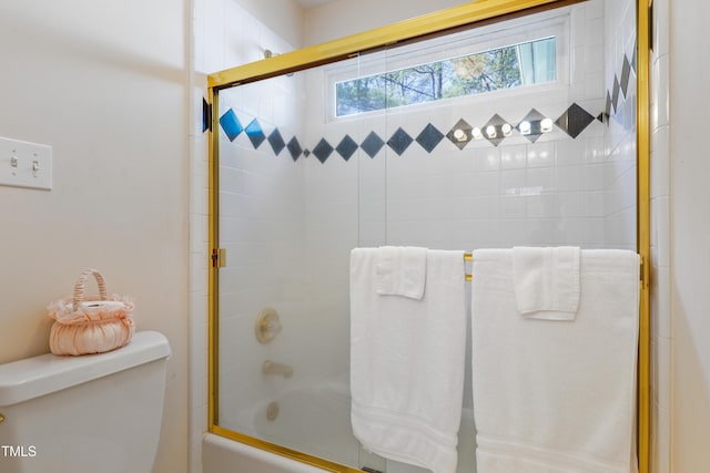 full bath featuring enclosed tub / shower combo and toilet