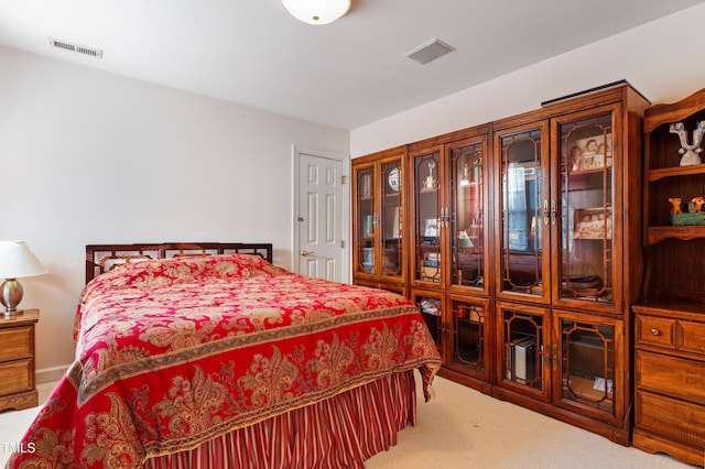 bedroom featuring visible vents and carpet flooring