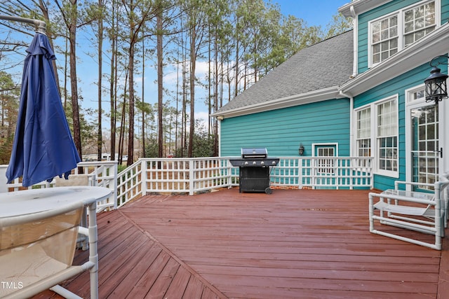 wooden deck featuring grilling area