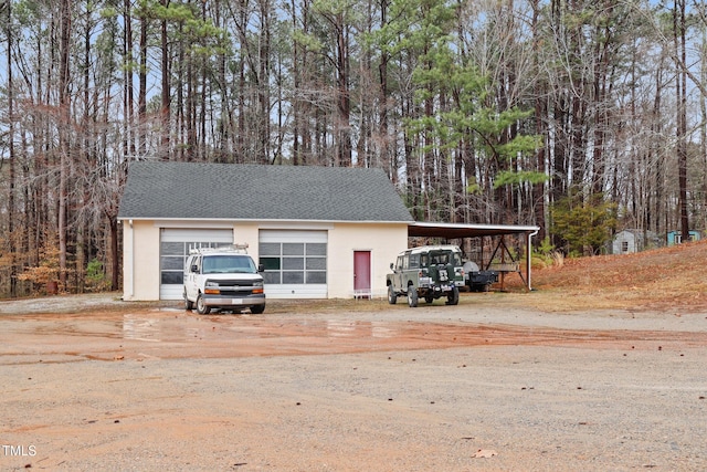 garage featuring driveway