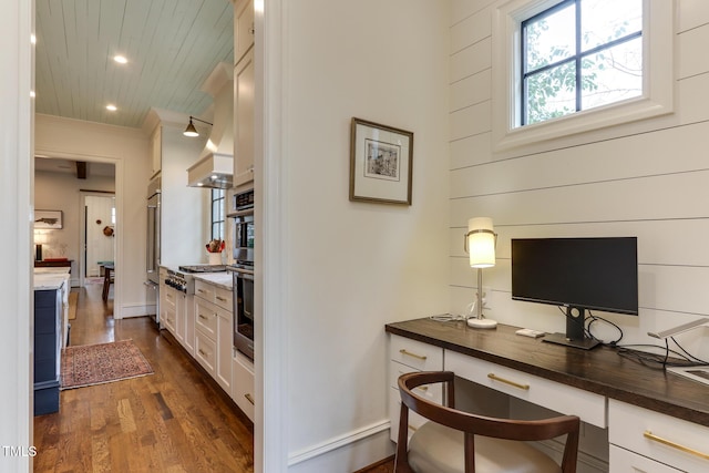 office area featuring ornamental molding, recessed lighting, and dark wood finished floors