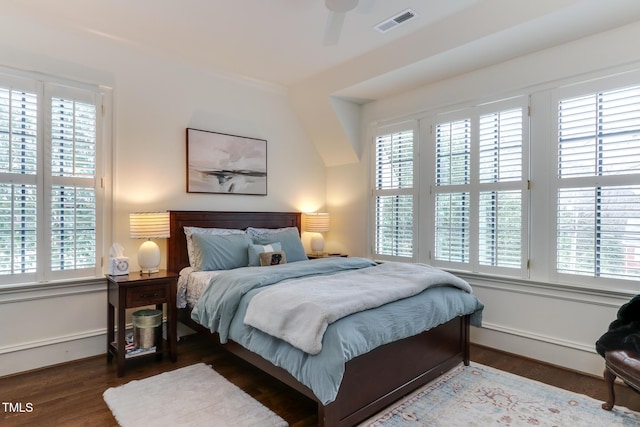 bedroom featuring visible vents and wood finished floors