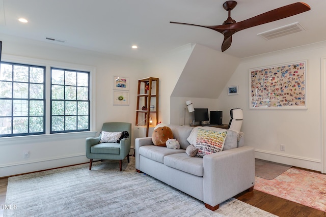 living room featuring recessed lighting, visible vents, baseboards, and wood finished floors